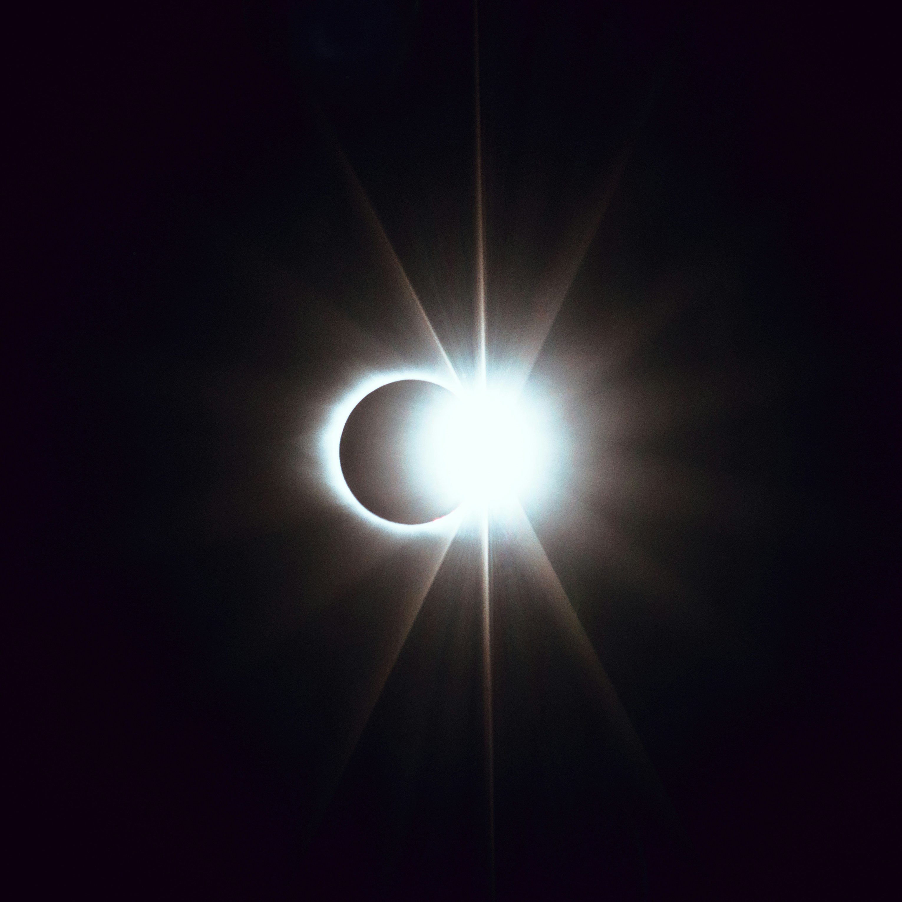 Partial solar eclipse low in the evening sky