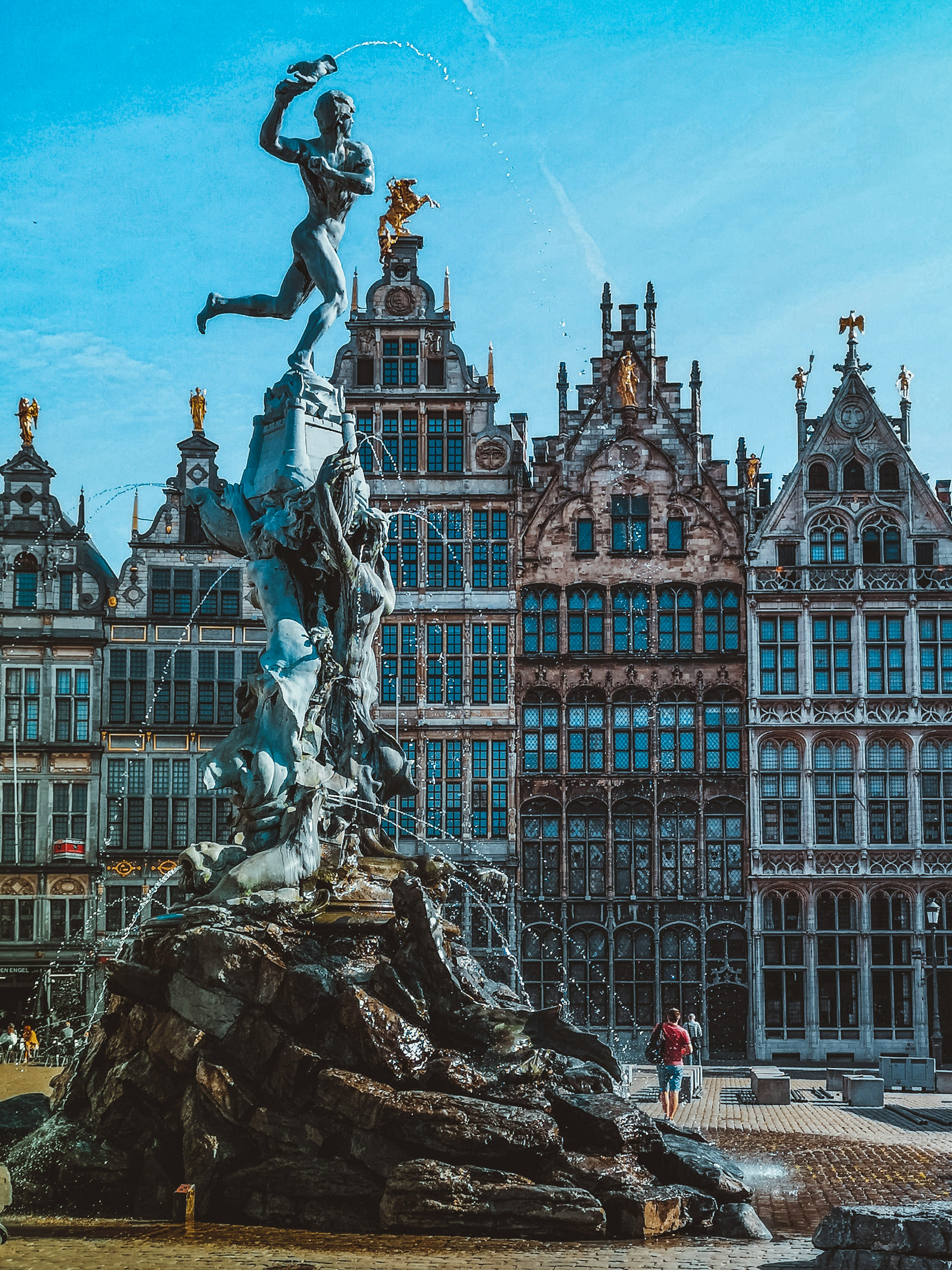 Belgian square with fountain and historic guild houses