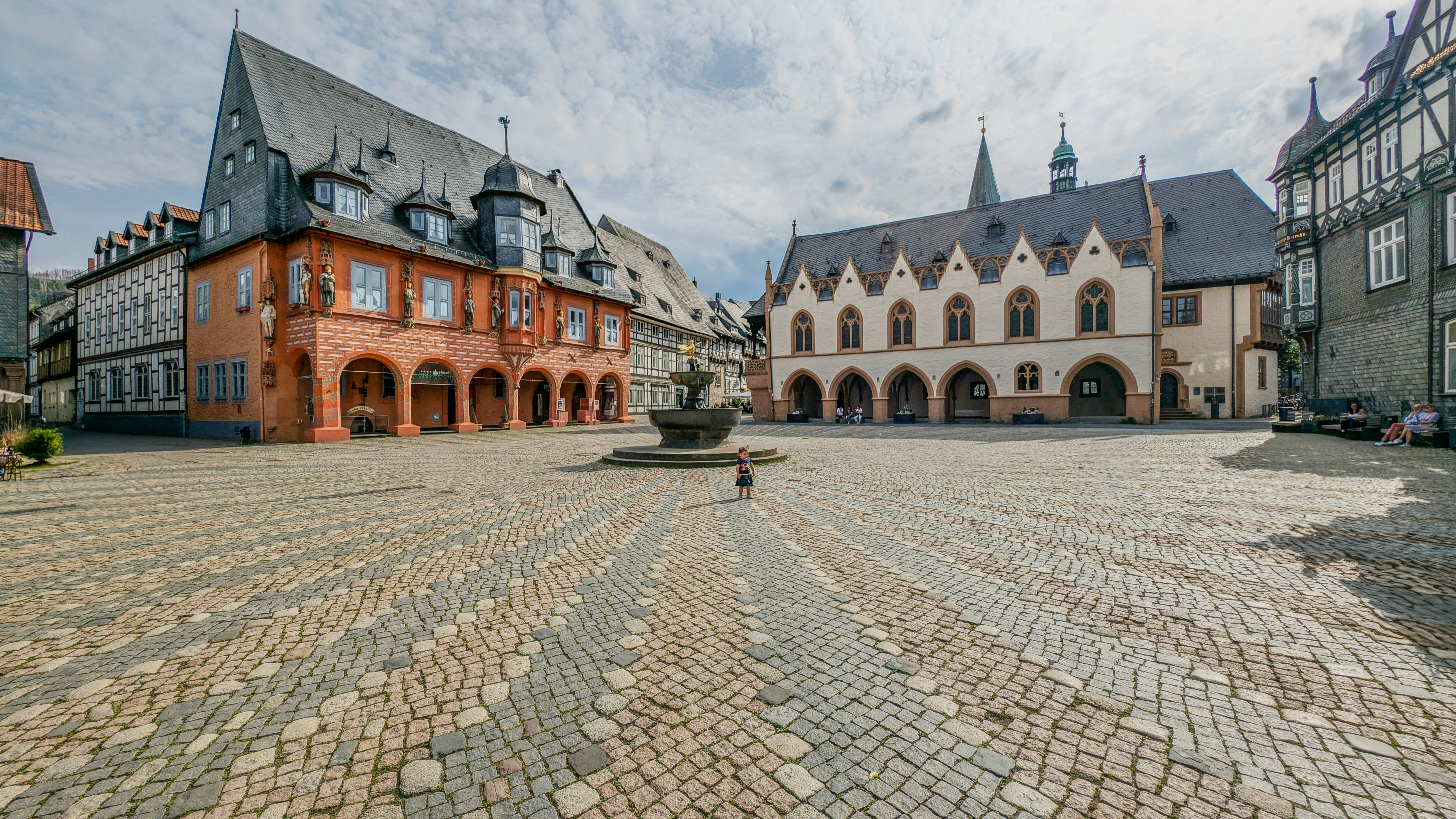 Wide cobblestone square and historic buildings in Goslar