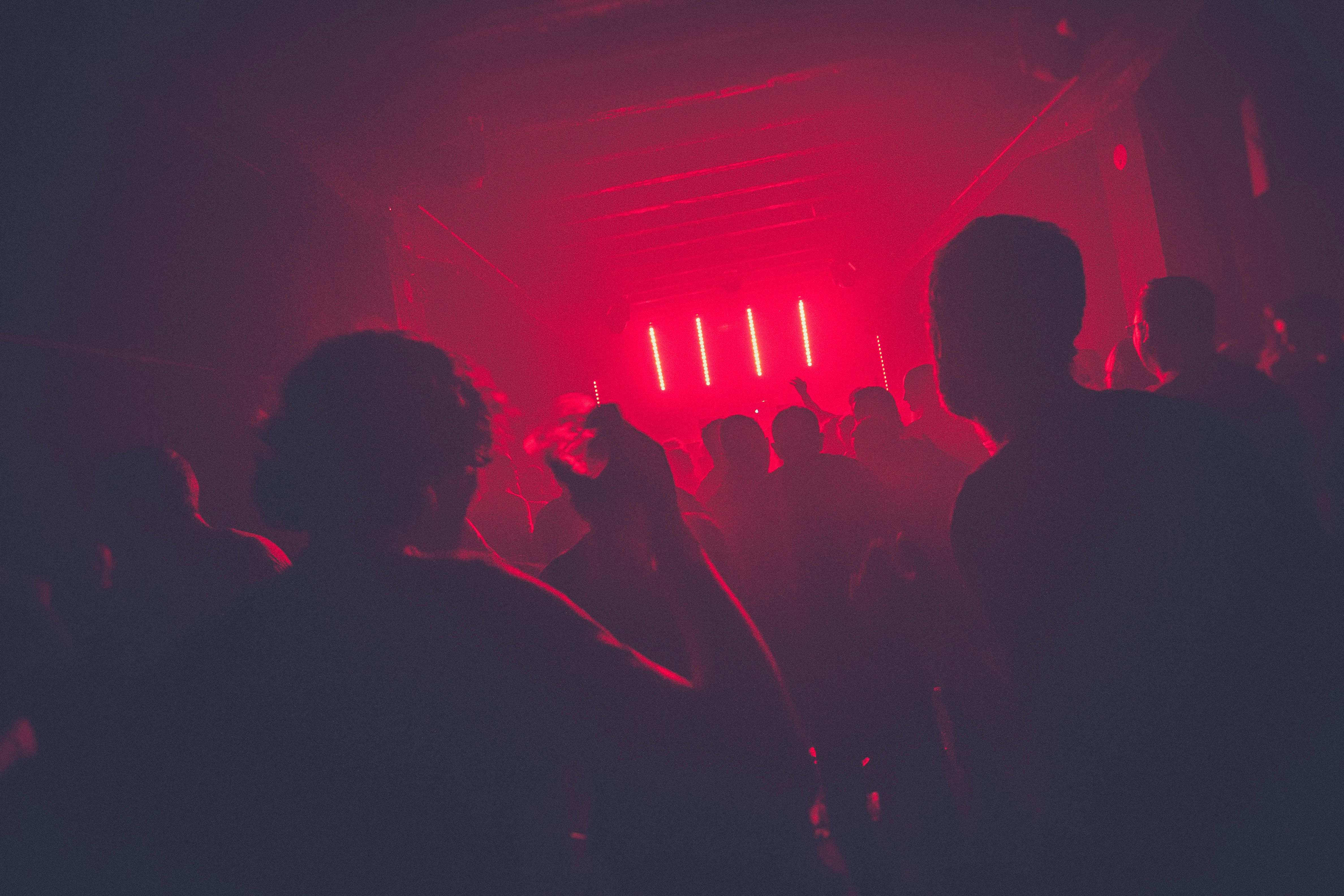 Crowd at a club with lights and smoke