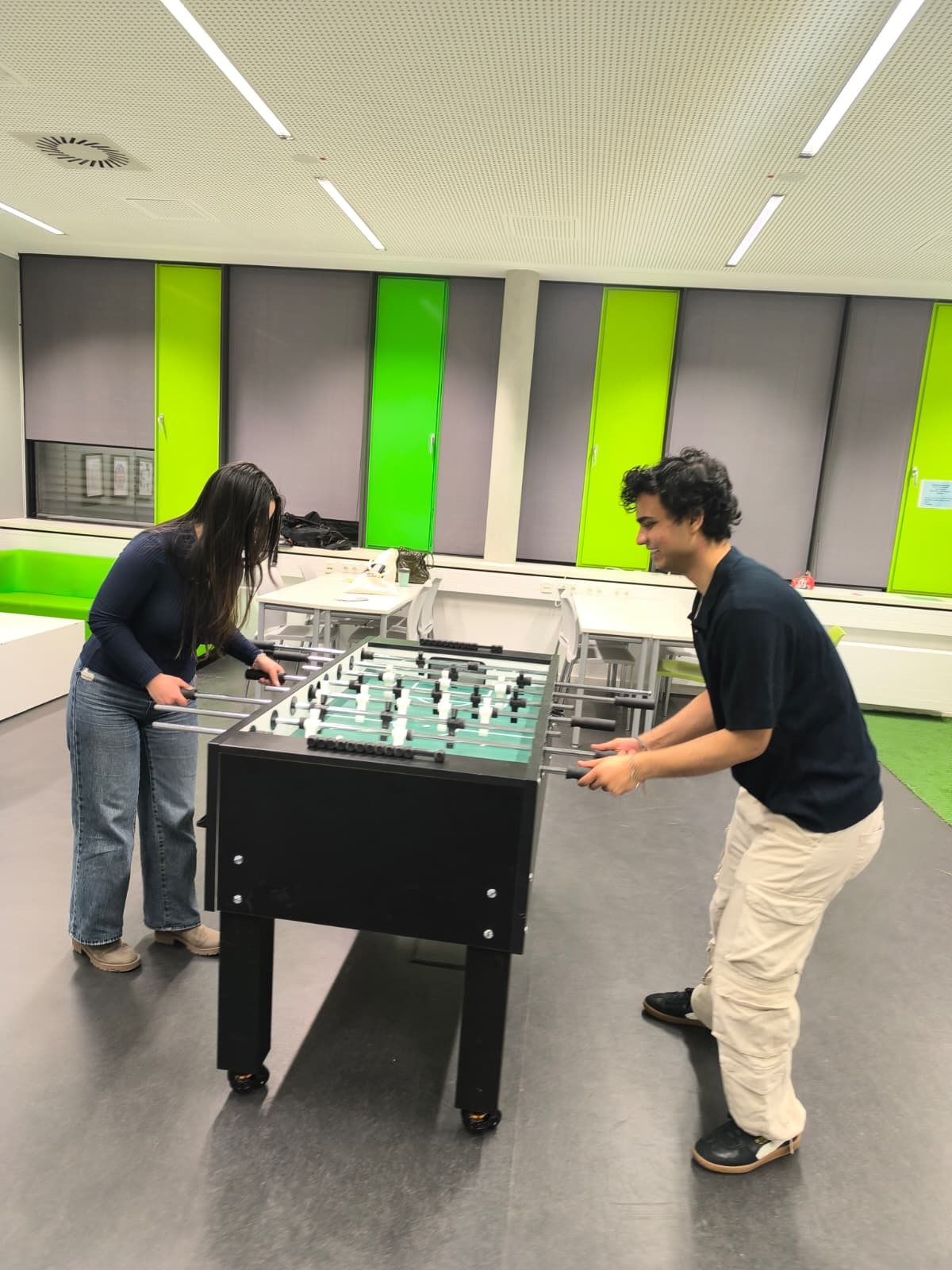Students gathering around a table during a Study and Chill Lounge activity